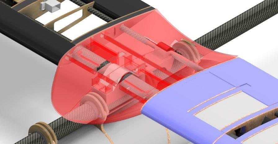 A translucent red fairing over the wing-fuselage joint in the aircraft CAD model